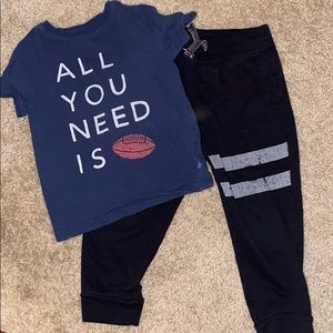 Black sweat pants and football tshirt